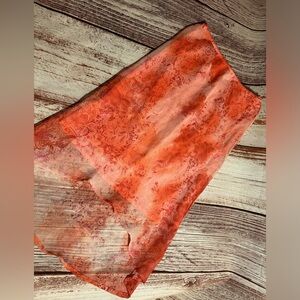 Salmon colored skirt size 12/14 by Amy Byer. Sheer print overr polyester slip.